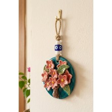 Nazar Boncuklu Çiçek Figürlü Dekoratif Duvar Süsü – Turkuaz Renkli Askılı Duvar Dekoru