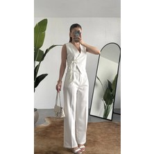 Asfa Moda Kadın Beyaz Asimetrik Kesim Kruvaze Bağlamalı Yelek ,pileli Plazzo Pantolon Takım