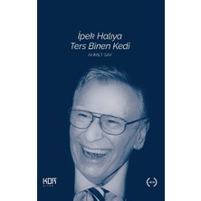 Kor Kitap Ipek Halıya Ters Binen Kedi