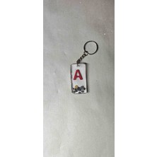 Miina Aksesuar Epoksi Malzeme ve Doğal Taşlar Kullanılarak Üretilmiş Kişiye Özel Harfli Anahtarlıktır.