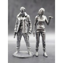 Resident Evil 9: Requiem - Leon S. Kennedy & Grace Ashcroft Ikili Figür Seti - (Metalik Renk Boyalı)