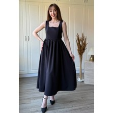 Dilay Gökoğlu Butik Sırtı Fiyonk Detaylı Askılı Midi Kloş Siyah Elbise