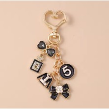 My Balli Store Gold Kalp Kancalı Lüks Çanta Anahtarlık Charmı - No:5, Parfüm ve Fiyonk Detaylı Siyah Emaye Taşlı Çanta Aksesuarı