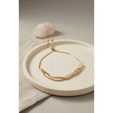 Clariss Gold Renk Baget Zirkon Taşlı Sarmal Model Pirinç Asansör Bileklik
