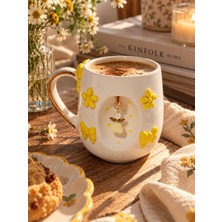Ceres Shop Ceresshop El Yapımı Sarı Çiçekli ve Fiyonklu Melek Charm Detaylı Seramik Kupa