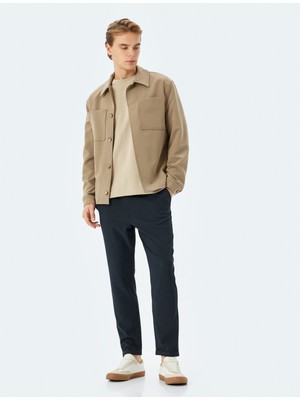 Koton Katlamalı Paça Viskon Karışımlı Düğmeli Beli Bağcıklı Slim Fit Pantolon