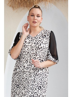Imagine Giyim Stil ve Rahatlığın Mükemmel Buluşması: Çift Kol Detaylı Leopar Desenli Büyük Beden Ekru Elbise
