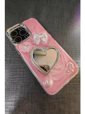 Caş Dekorasyon Pembe Renk Kalp ve Kurdele Figürlü Aynalı 15 Pro Max Telefon Kılıfı