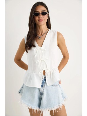 Kadın Ekru Önü Bağlamalı Kolsuz Eteği Fırfırlı Muslin Bluz