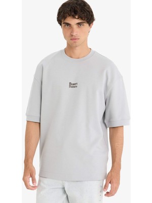 DeFacto Nefes Alabilen Loose Fit Baskılı Tişört E9550AX25AU