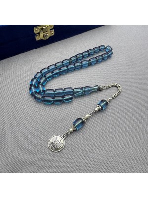 Alpaka Püsküllü Açık Mavi Renk Kapsül Kesim Sıkma Kehribar Tespih