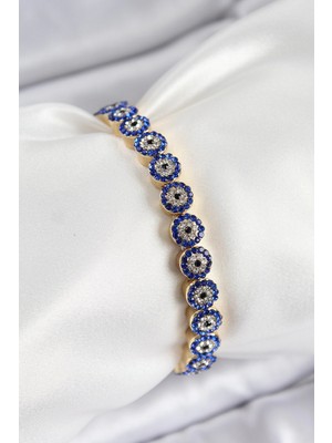 Pirinç Zirkon Taşlı Lacivert Nazar Model Gold Renk Lastikli Kadın Bileklik