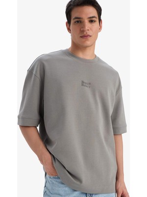 DeFacto Nefes Alabilen Loose Fit Baskılı Tişört E9550AX25AU
