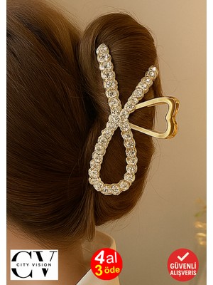 Taş Detaylı Gold Fiyonk Formlu 11 cm Saç Tokası – Zarif ve Işıltılı Tasarım