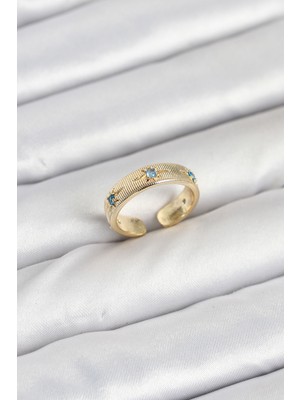 Toptan Bulurum Pirinç Gold Renk Mavi Zirkon Taşlı Kutup Yıldızı Model Kadın Yüzük