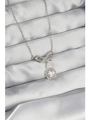 Inure Jewelry 316L Çelik Gümüş Renk Fiyonk Detay Zirkon Taşlı Tektaş Kolye