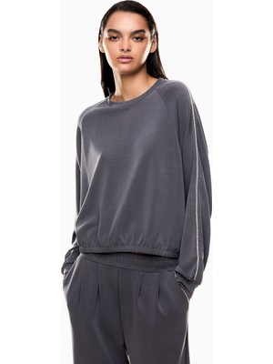 EA7 Kadın Metalik Efektli Logo Uzun Kol Rahat Kesim Lastikli Etek Ucu Siyah Eşofman Üstü 7W000444 AF12643-U8117