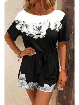 Kadın Tek Omuzu Açık Çiçek Desenli Beli Kuşaklı Iki Iplik Mini Short Tulum