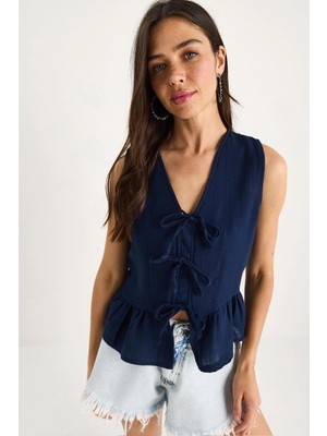 Tena Kadın Lacivert Önü Bağlamalı Kolsuz Eteği Fırfırlı Muslin Bluz