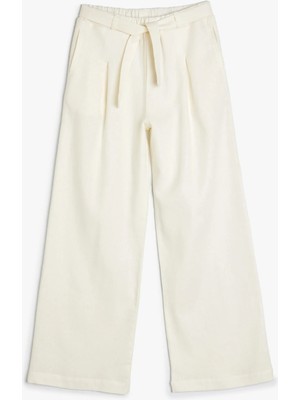 Koton Kız Çocuk Keten Pantolon Bol Paça Ekru Cepli Beli Lastikli Kemer Detaylı Model
