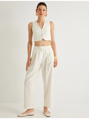 Koton x Melis Ağazat - Havuç Kesim Pantolon Cepli Pile Detaylı Tencel™ Kumaş