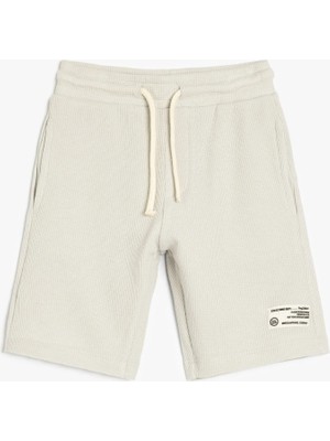 Koton Pamuklu Beli Bağlamalı Aplike Detaylı Cepli Şort