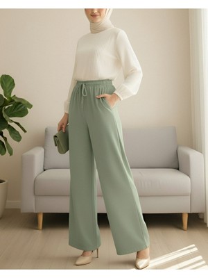 Modamorfo Beli Lastikli Bağcık Detaylı Cepli Bol Paça Tensel Pantolon -Çağla Y.