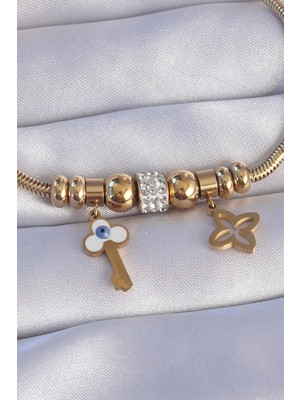 Alvo Store Buğz 316L Çelik Gold Renk Zirkon Taşlı Yonca Detay Nazarlı Anahtar Tasarımlı Bileklik - Buğz