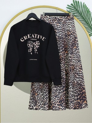 Moda Morfo Yuvarlak Yaka Fiyonk Baskılı Leopar Etekli Takım -Siyah