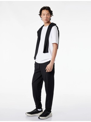 Koton Siyah Erkek Pamuklu Fermuarlı Cepli Lastikli Paça Beli Bağcıklı Jogger Spor Eşofman Altı Model Kodu: 6SAM40018NKSIYAH