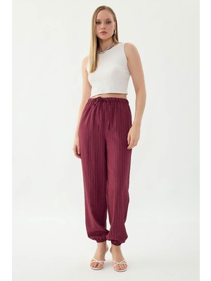 Vitrin Beli ve Paçası Lastikli Çizgi Desen Şalvar Pantolon