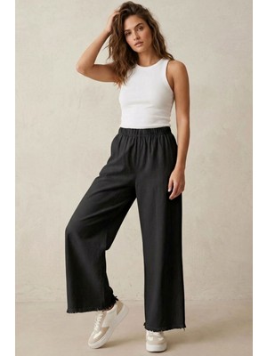 Modestim Kadın Siyah Beli Lastik Özel Yıkamalı Kumaş  Paçaları Püsküllü Geniş Paça Tesettür Pantolon