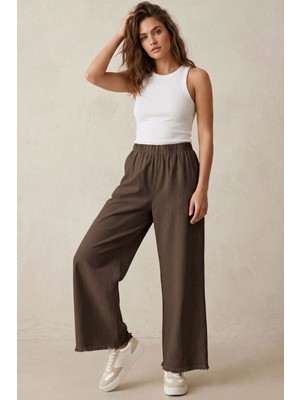 Modestim Kadın Kahve Beli Lastik Özel Yıkamalı Kumaş  Paçaları Püsküllü Geniş Paça Tesettür Pantolon