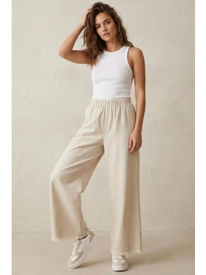 Modestim Kadın Bej Beli Lastik Özel Yıkamalı Kumaş  Paçaları Püsküllü Geniş Paça Tesettür Pantolon