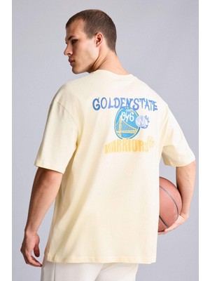 DeFacto %100 Pamuk NBA Golden State Warriors Lisanslı Oversize Kısa Kollu Sarı Tişört H3425AX26SM