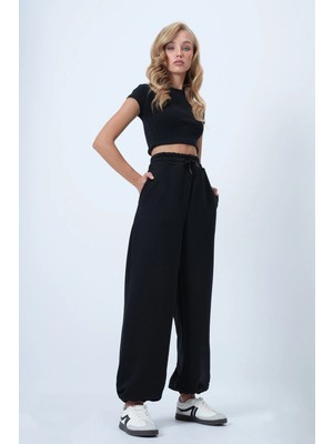 TeknoKapsül Trend Alaçatı Stili Siyah Çift Cepli Beli ve Paçası Lastikli Örme Pantolon ALC-X14580