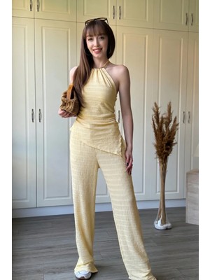 Dilay Gökoğlu Butik Boyundan Bağlamalı Gold Aksesuarlı Asimetrik Pantolon Takım