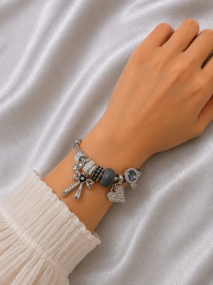 Bymiel Kadın Silver Charm Bileklik Siyah Taşlı Fiyonk ve Kalp Figürlü Çelik Burgu Bileklik