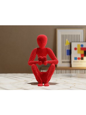 Belirtilmemiş 3D Baskı Kalp Tutan Oturan Insan Figürü – Dekoratif Masaüstü Biblo ve Anlamlı Hediye