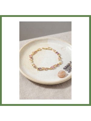 Bezos Pirinç Gold Renk Pembe ve Mor Zirkon Taşlı Çiçek Model Kadın Bileklik HB006