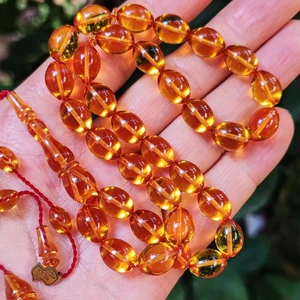 Vip Kehribar 8X11 mm Ali Agiş Usta Işçilikli Altın Rengi Zar Kehribar Tesbih - Şeffaf Delim Tespih