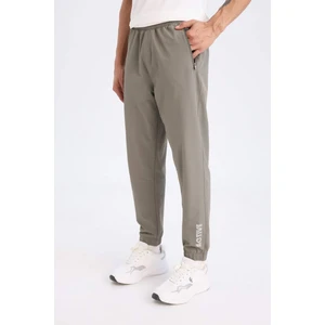 DeFactoFit Dokuma Esnek Multifonksiyonel Sporcu Jogger Eşofman Altı Slim Fit Dar Kesim Çift Cepli C1212AX25SP