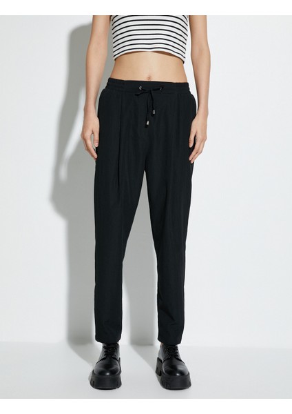 Paraşüt Pantolon Havuç Kesim Beli Bağcıklı Cep Detaylı modelleri