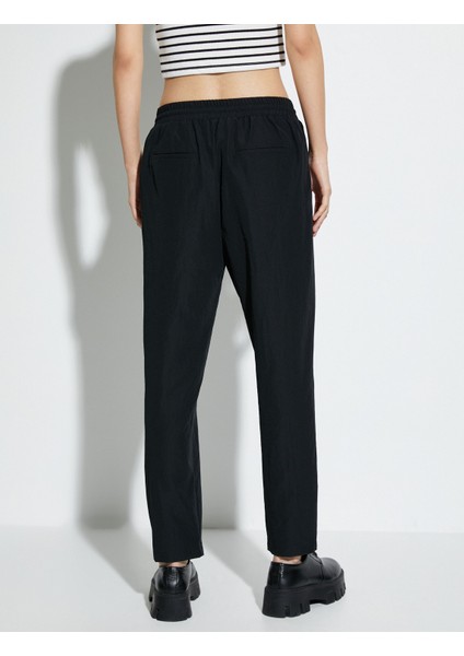 Paraşüt Pantolon Havuç Kesim Beli Bağcıklı Cep Detaylı fırsatları