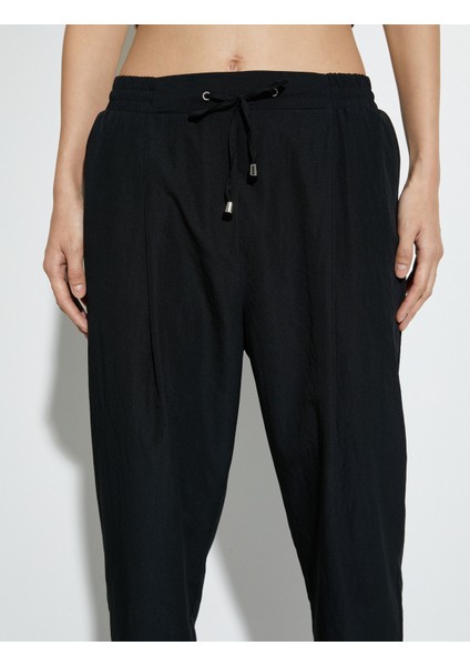 Paraşüt Pantolon Havuç Kesim Beli Bağcıklı Cep Detaylı indirimleri