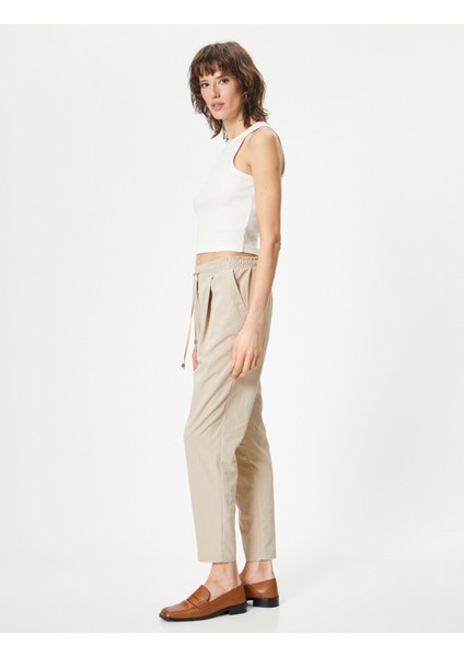 Paraşüt Pantolon Havuç Kesim Beli Bağcıklı Cep Detaylı fiyatları