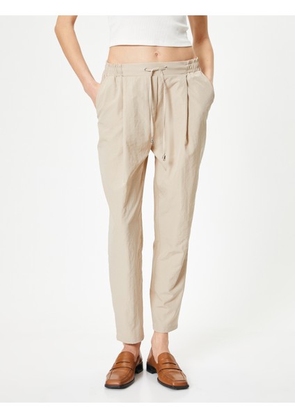 Paraşüt Pantolon Havuç Kesim Beli Bağcıklı Cep Detaylı modelleri