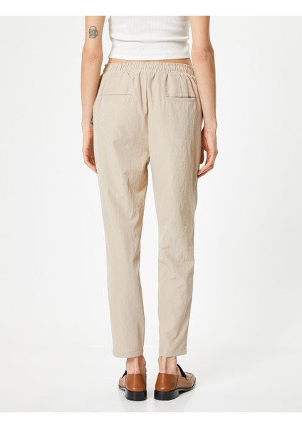 Paraşüt Pantolon Havuç Kesim Beli Bağcıklı Cep Detaylı fırsatları