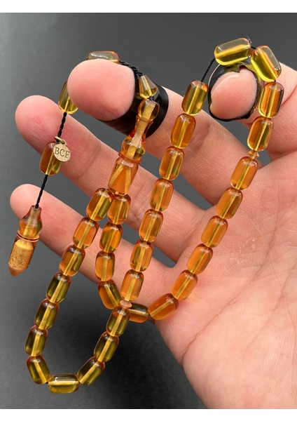 Ateş Kehribar Tesbih Sarı Kapsül Model 7X11MM 33 Tane Sistemli Tane Boşlukları Ayarlanabilir Püskül AK04075.180324
