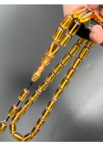 Ateş Kehribar Tesbih Sarı Kapsül Model 7X11MM 33 Tane Sistemli Tane Boşlukları Ayarlanabilir Püskül AK04075.180324